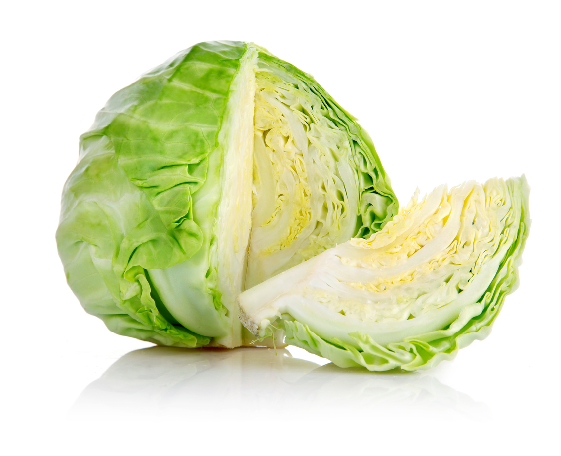 fresh green cabbage with cut isolated on white background