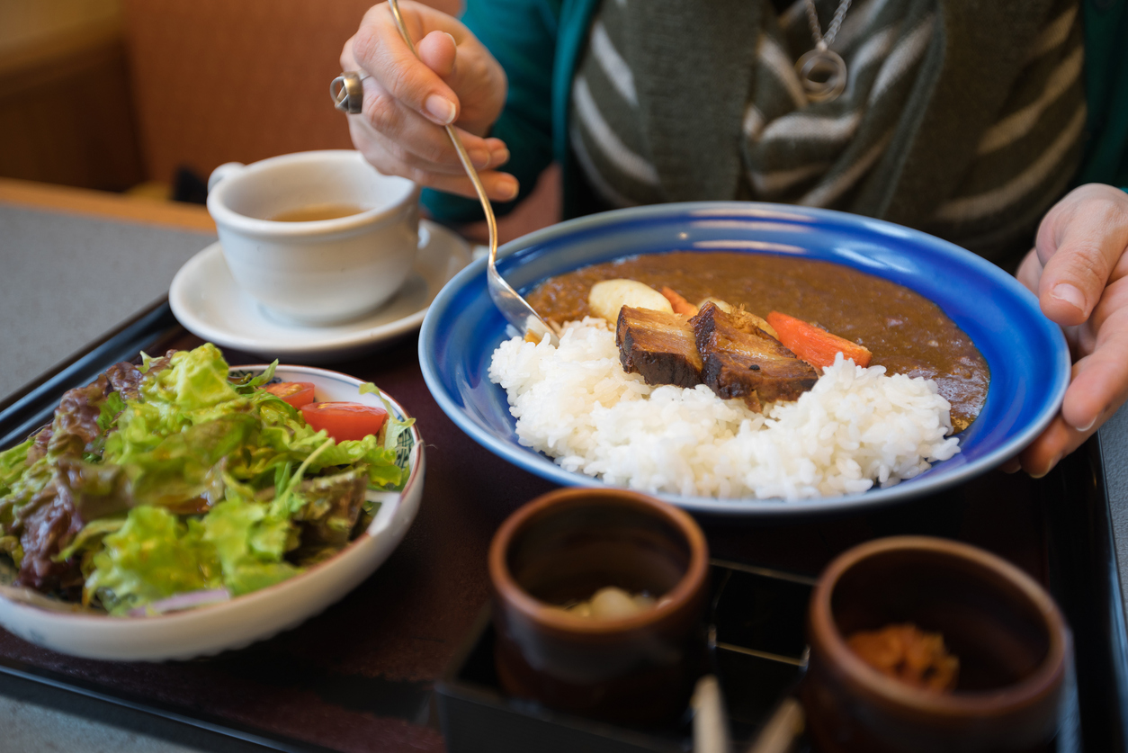 Japanese lunch meal of curry, rice, salad and soup