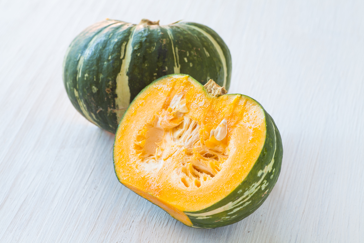 Kabocha, is Japanese pumpkin slice or green pumpkin on white background