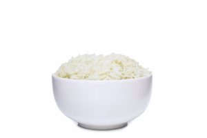Bowl full of herb rice isolated on white background