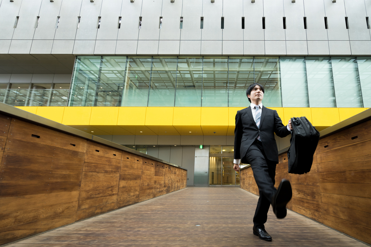 It is Men in suits walking vigorously (business image)