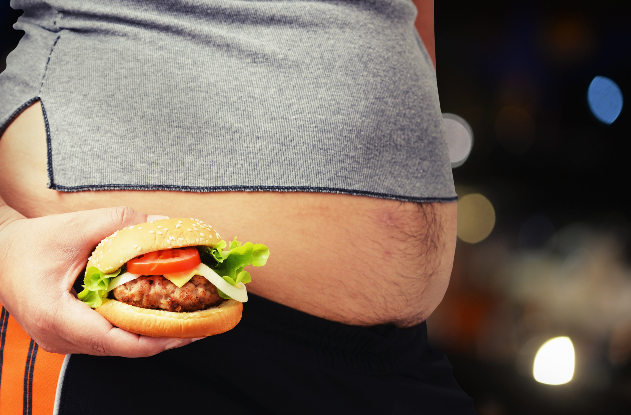 fat man eat hamburger