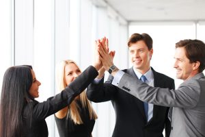 Business people giving high five