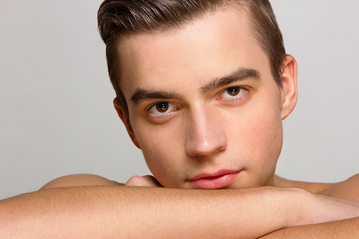 young man model beautiful skin portrait studio