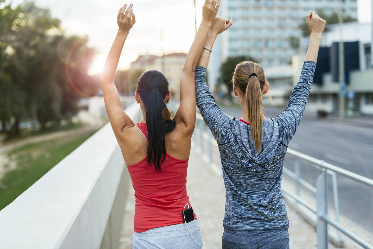 Two women happy after finishing exercises