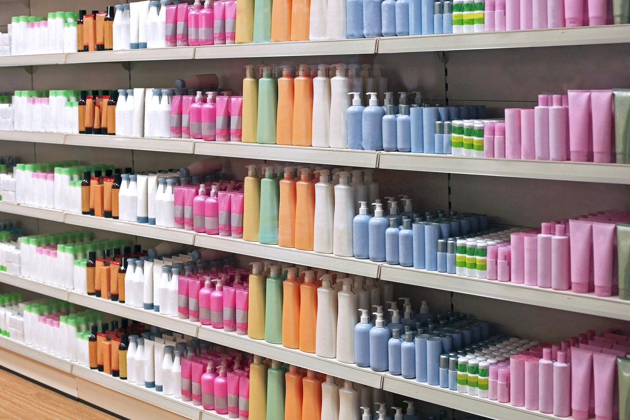 Colorful toiletries plastic bottles in retail store shelves
