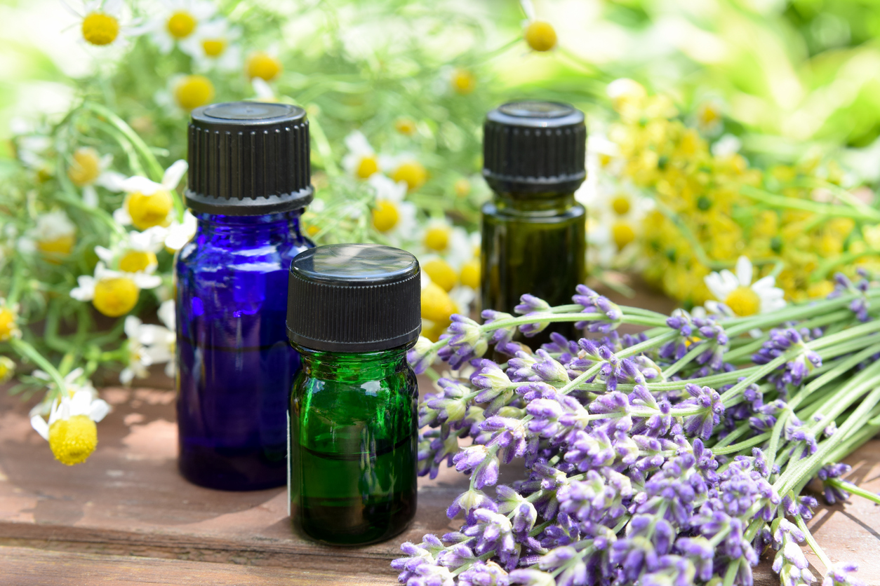 essential oils and herbal flowers for aromatherapy treatment