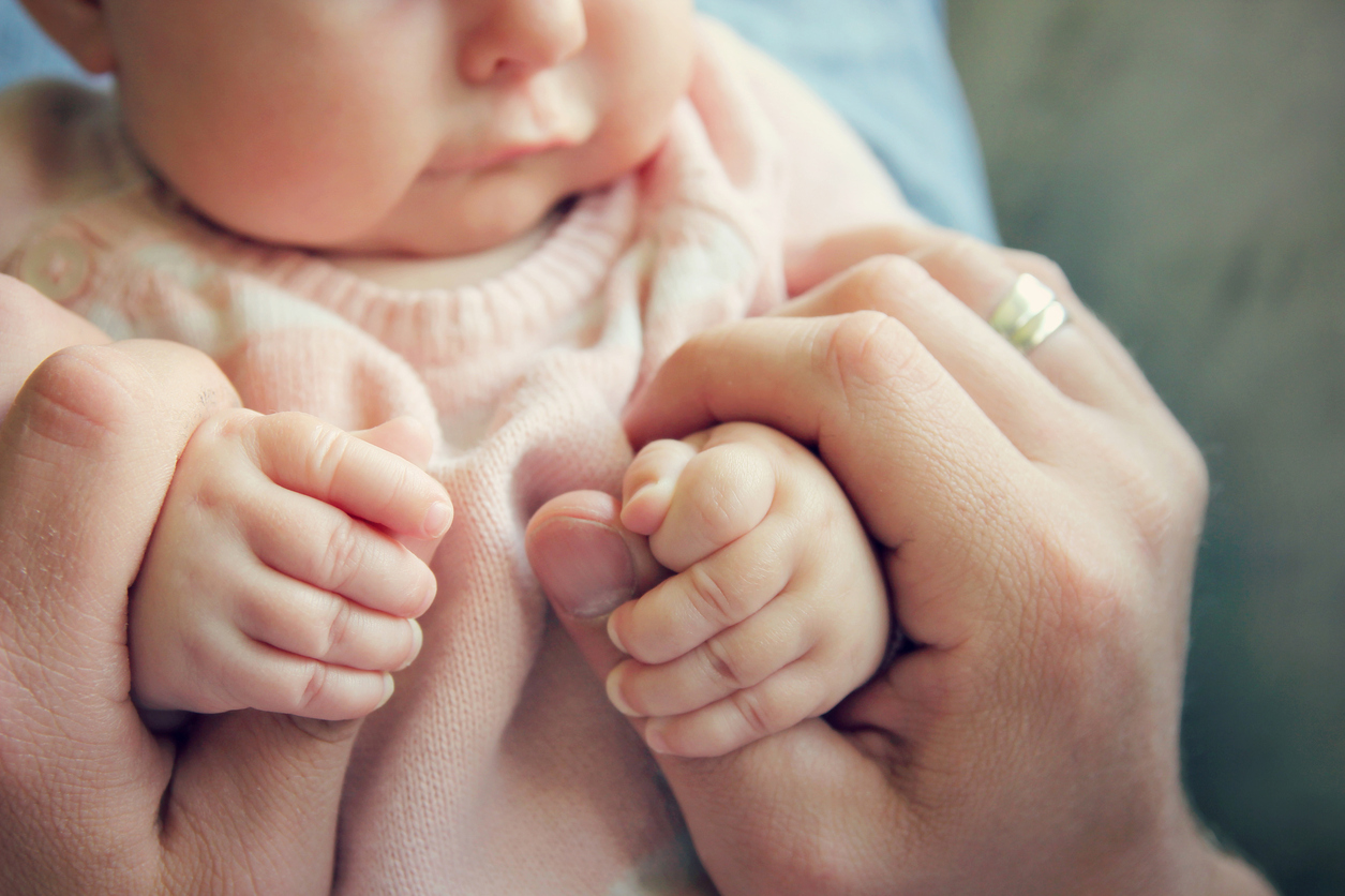 Newborn Baby Girls Hands Holding Fathers Fingers